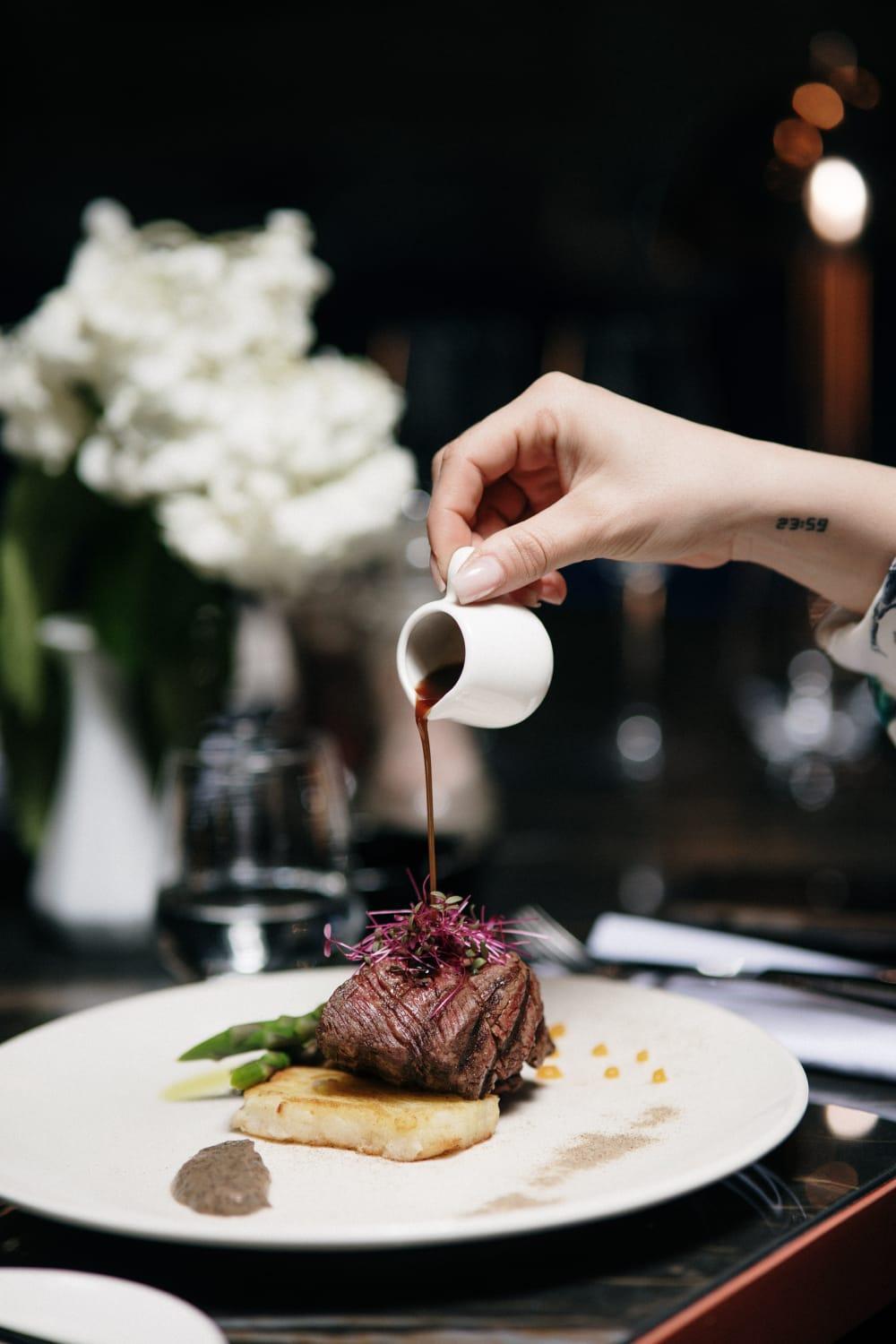 Xheko Imperial Luxury Hotel & Spa تيرانا المظهر الخارجي الصورة A server pours soy sauce onto a dish